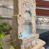 a stone sculpture with blue paint on it