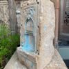 a stone sculpture with blue paint on it