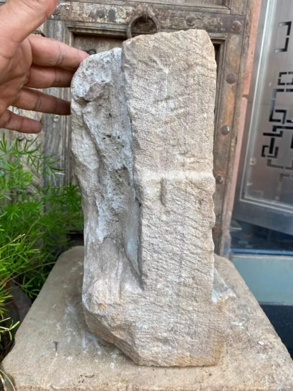 a hand holding a rock