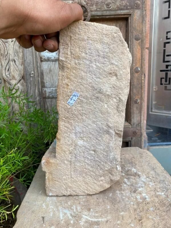 a hand holding a stone