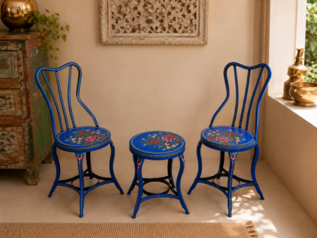 Add a vibrant artistic touch to your space with this handcrafted 3-piece bistro set featuring two vintage-style iron chairs and a matching round table. Finished in a striking blue color with intricate hand-painted floral artwork, this unique set is perfect for balconies, patios, cafés, gardens, and indoor seating areas. Specifications Set Includes: 2 Chairs + 1 Round Table Material: Iron Finish: Hand-Painted Blue Floral Finish Color: Turquoise Blue Style: Vintage / Bohemian / Cottage Suitable For: Balcony, Patio, Garden, Café, Bistro, Indoor Seating Condition: Vintage