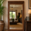 Hand carved wooden floor mirror with traditional vintage finish leaning against a living room wall (80 x 43 inches)-collectible vintage
