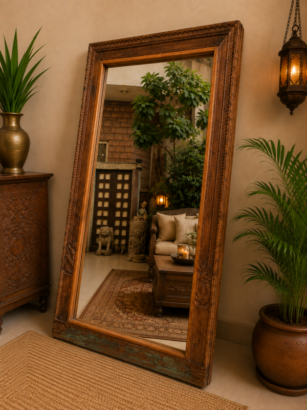 Reclaimed wood floor mirror with vintage carved trim standing against a wall in a living room interior (76 x 43 inches)-collectible vintage