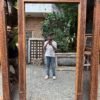 Hand carved wooden floor mirror with traditional vintage finish leaning against a living room wall (80 x 43 inches)-collectible vintage3