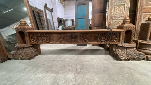 Handcrafted wooden TV unit with intricate carvings, decorative candle niches and rustic antique finish-COLLECTIBLE VINTAGE