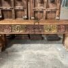 Handcrafted wooden TV console table with intricate carved front panel in a vintage living room-COLLECTIBLE VINTAGE2